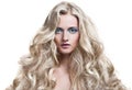 Blonde Girl. Healthy Long Curly Hair. Royalty Free Stock Photo