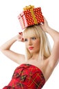 Blonde girl holding christmas gift Royalty Free Stock Photo