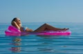 Blonde girl on inflatable raft Royalty Free Stock Photo