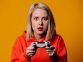 Blonde girl keen plays with a joystick Royalty Free Stock Photo