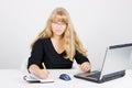 Blonde girl with a laptop Royalty Free Stock Photo