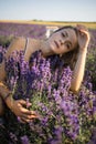 Blonde girl in lavender fields in Provence in spring or summer field with Boho style clothing Royalty Free Stock Photo