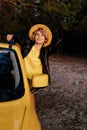 Blonde Girl Leaning out of Car Window Front Shot