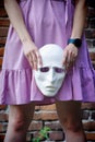 A blonde girl in a lilac dress walks through the ruins of an old brick building Royalty Free Stock Photo