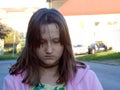 Teen girl reading phone on street Royalty Free Stock Photo