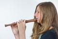 Blonde girl playing flute Royalty Free Stock Photo