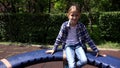 Blonde Girl Playing at Playground, Child Spinning, Rotating on Merry-Go-Round in Park, Face of Happy Kid Plays Outdoor in Nature