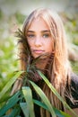 Blonde girl portrait with green cane