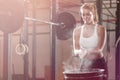 Blonde girl preparing to weightlifting at fitness center Royalty Free Stock Photo