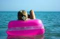 Blonde girl on raft Royalty Free Stock Photo