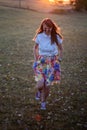 Blonde girl running through the field Royalty Free Stock Photo