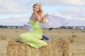 Blonde girl in sloping field Royalty Free Stock Photo