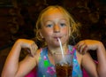 Child Drinks Soft Drink with Straw Royalty Free Stock Photo