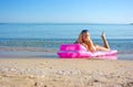 Blonde girl in swimming mattress Royalty Free Stock Photo