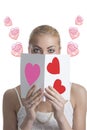 Blonde girl with valentine postcard forward the face