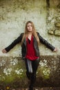 Blonde girl on a vintage wall