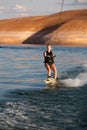 Blonde Girl Wakboarding at Sunset Royalty Free Stock Photo