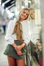 Blonde girl smiling with defocused urban city lights at night Royalty Free Stock Photo