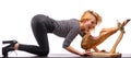 A blonde girl whole jamon on a wooden stand.