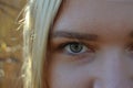 Blonde girl woman gray eye in nature