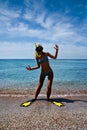 Blonde girl in yellow flippers and swimming mask Royalty Free Stock Photo