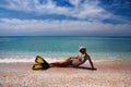 Blonde girl in yellow flippers and swimming mask Royalty Free Stock Photo