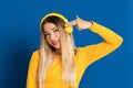 Blonde girl yellow headphones