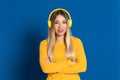 Blonde girl yellow headphones