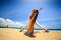 blonde girl in yoga asana triangle on beach