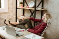 Blonde good-looking lady chilling on her working place