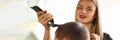 Blonde Hairstylist Cutting Man by Electric Shaver Royalty Free Stock Photo