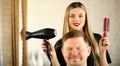 Blonde Hairstylist Using Dryer and Comb for Man