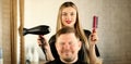 Blonde Hairstylist Using Dryer and Comb for Man Royalty Free Stock Photo