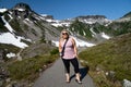 Blonde hiker poses on the Heather Meadows Trail in Mt. Baker National Recreation Area of Washington State