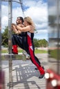 Blonde lady exercising with her personal trainer