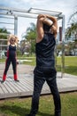 Blonde lady exercising with her personal trainer