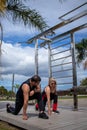 Blonde lady exercising with her personal trainer