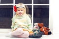 Blonde little girl in knitted sweater Royalty Free Stock Photo
