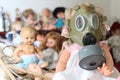 Blonde little girl with pollution mask