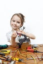 Blonde little girl repair a computer component Royalty Free Stock Photo