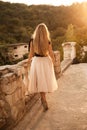 Blonde long hair, nature summer happy adult girl with long blond hair developing in the wind in nature. Dressed in a Royalty Free Stock Photo