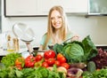 Blonde long-haired woman cooking with vegetables Royalty Free Stock Photo