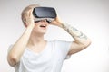 Blonde Man getting experience using VR headset glasses of virtual reality Royalty Free Stock Photo