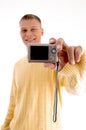 Blonde man showing digital camera Royalty Free Stock Photo