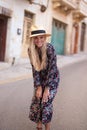 Blonde Mediterranean woman floral pattern dress posing at Valletta