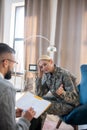 Blonde mid-aged service woman having military rehabilitation