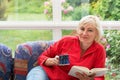 Blonde middle-aged woman is relaxing
