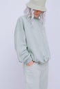 Blonde model in casual comfort aqua menthe monochrome street outfit. Spring summer collection. Fresh nature eco style concept.
