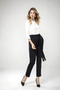 Blonde model posing in her black chic pants Royalty Free Stock Photo