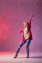 Blonde model posing over pink red background Royalty Free Stock Photo